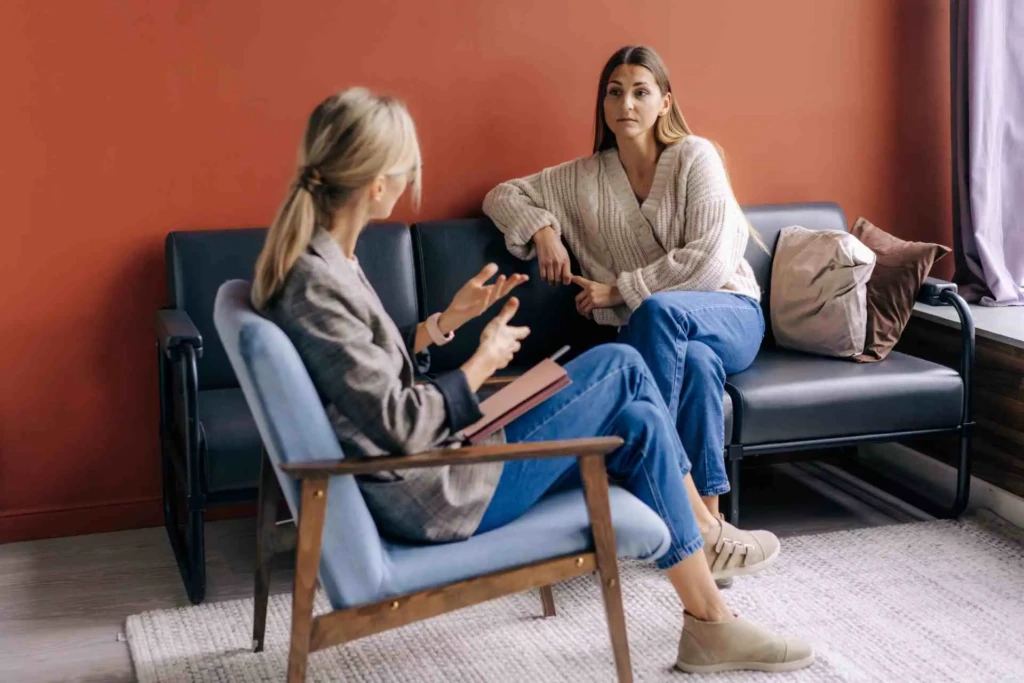 Woman speaking with a therapist during a one-on-one mental health therapy session