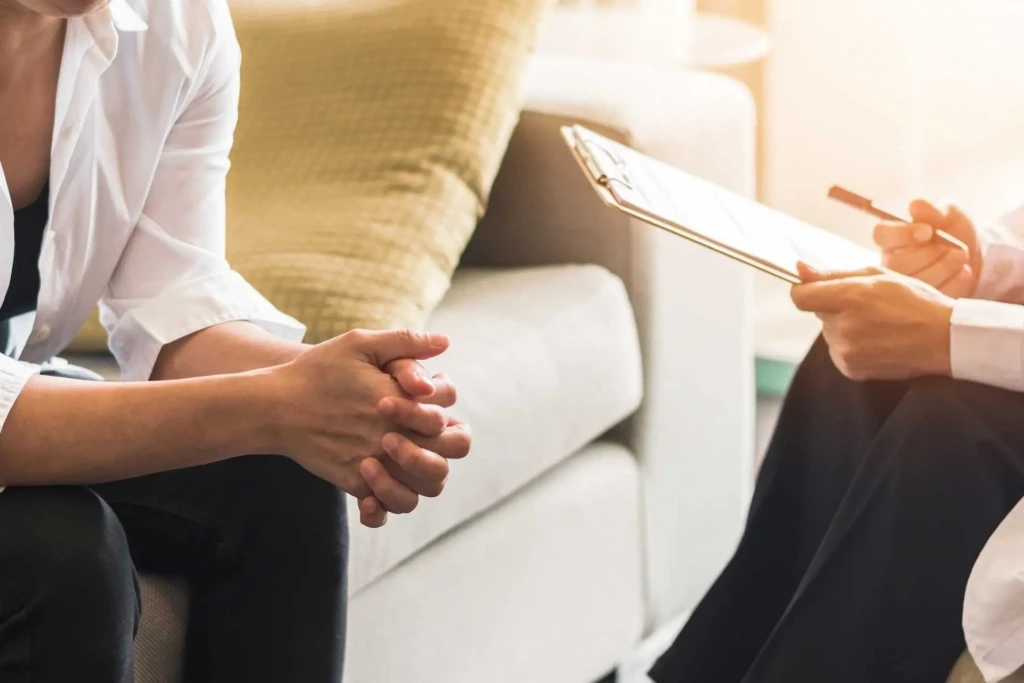 Patient speaking with a mental health professional during a treatment consultation