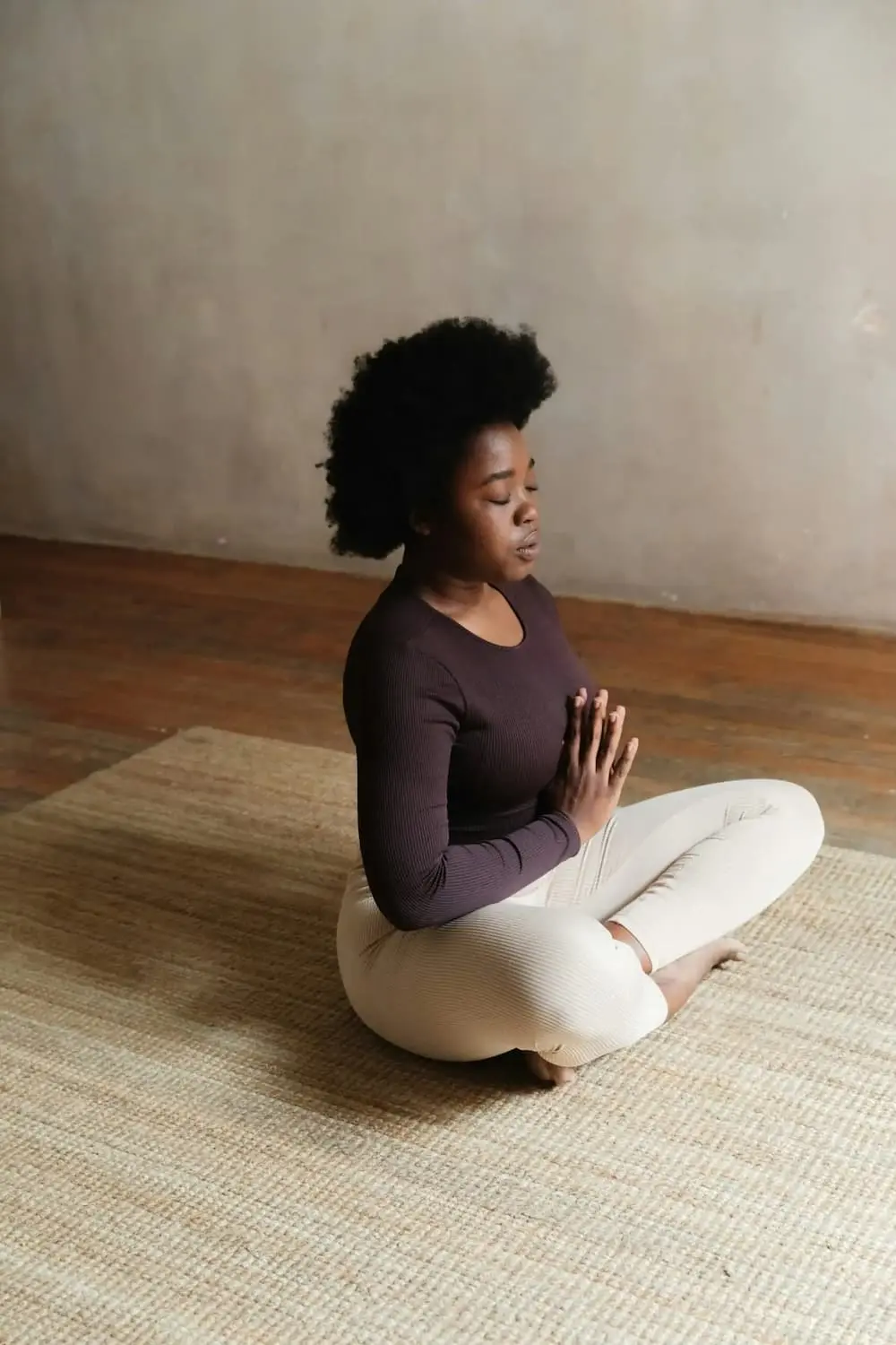 Woman practicing yoga for her mental health treatment